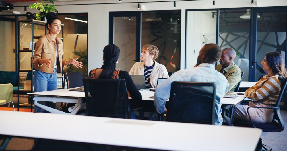 A cardiology care team meeting around a table