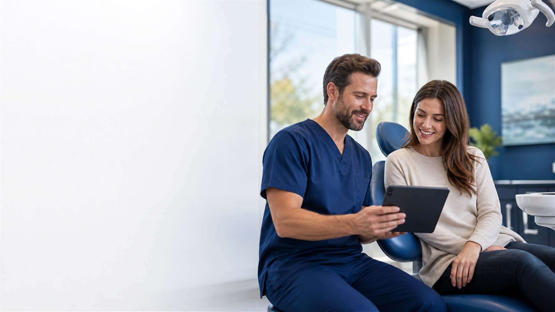 Dentist reviewing a treatment plan with a patient in a modern dental clinic